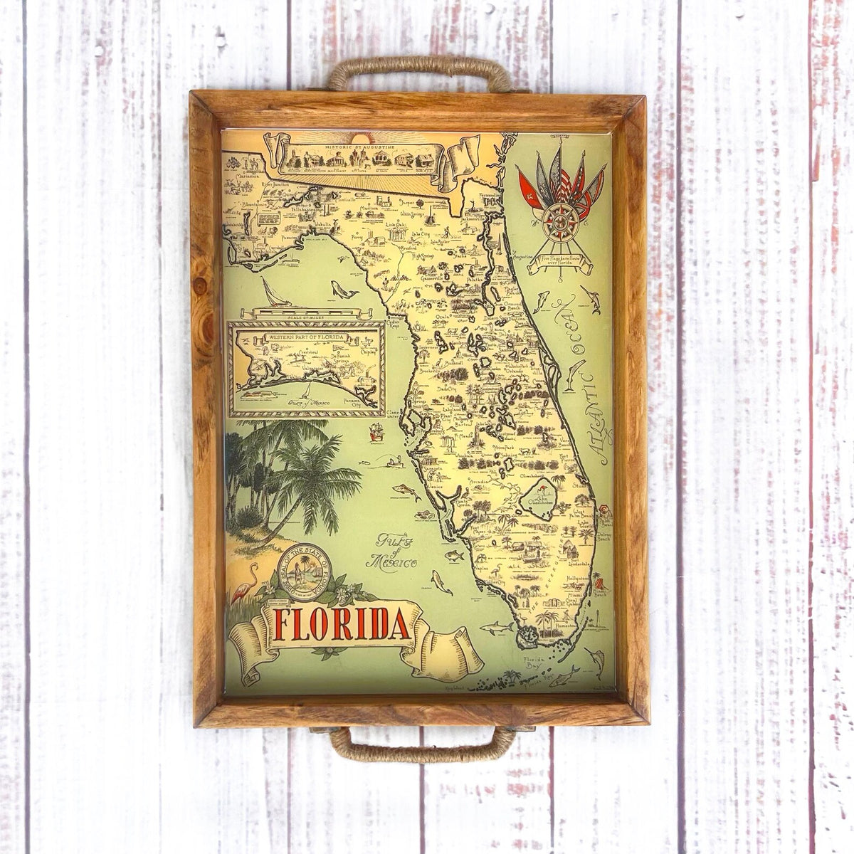 Map of Florida with decorative elements on a wooden surface and palm trees. vintage florida map