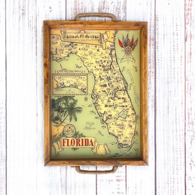 Map of Florida with decorative elements on a wooden surface and palm trees. vintage florida map