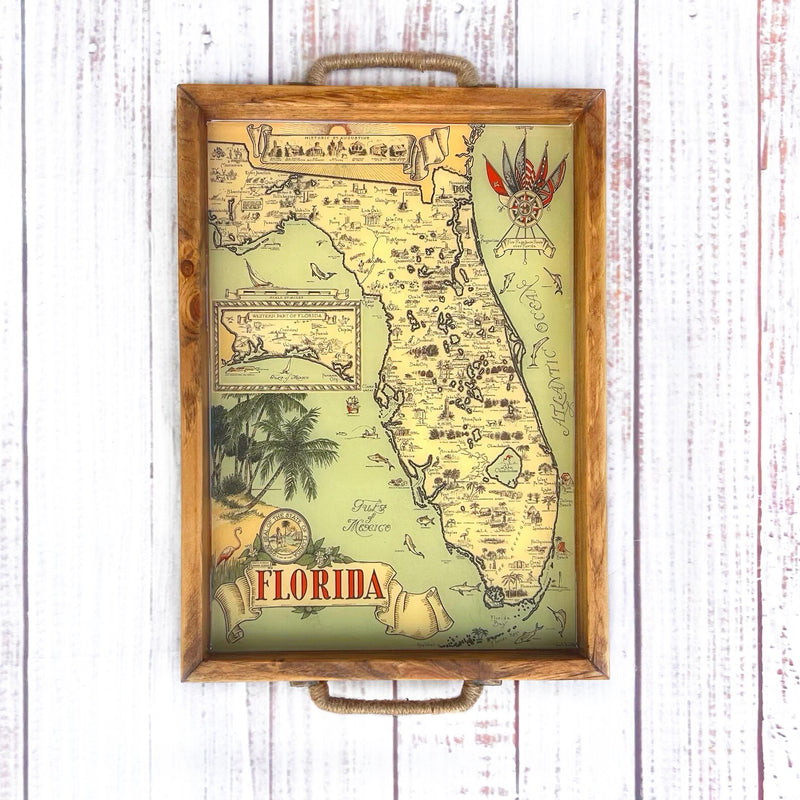 Map of Florida with decorative elements on a wooden surface and palm trees. vintage florida map