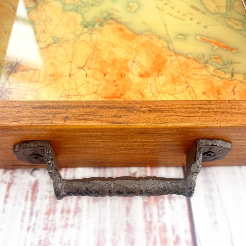 topographical map of lake winnipesaukee lake in new hampshire.  map of lake winnipesaukee in wooden tray with handles