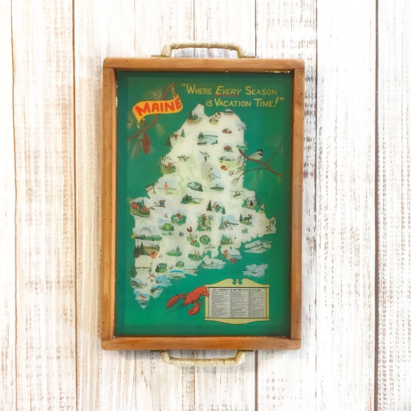 Map of Maine with scenic illustrations in a wooden serving tray.  pictoral travel map of maine