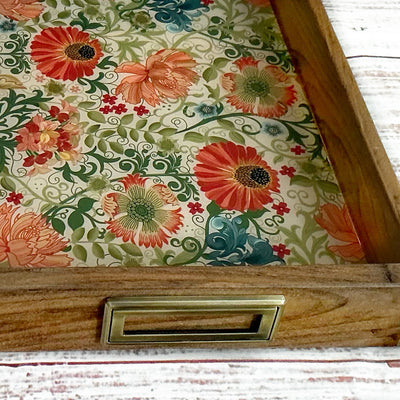 Handmade wooden serving tray featuring a colorful floral pattern with coral, pink, and green botanical designs for entertaining and gift giving