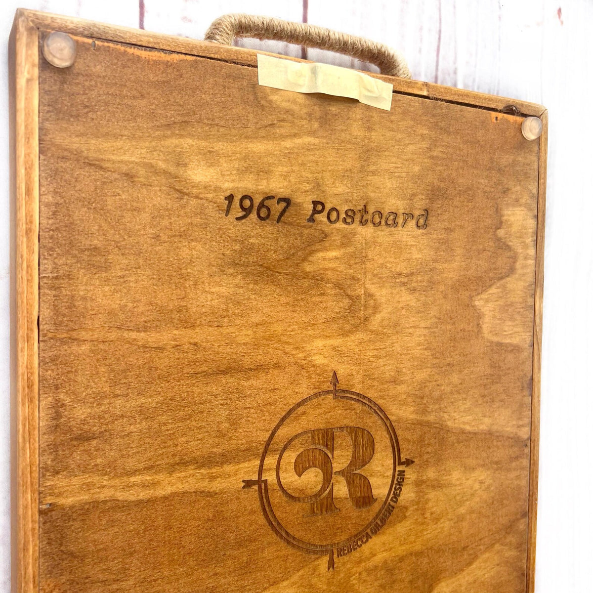 handmade wooden serving tray engraved with "1967 postcard" and rebecca gilbert design logo 